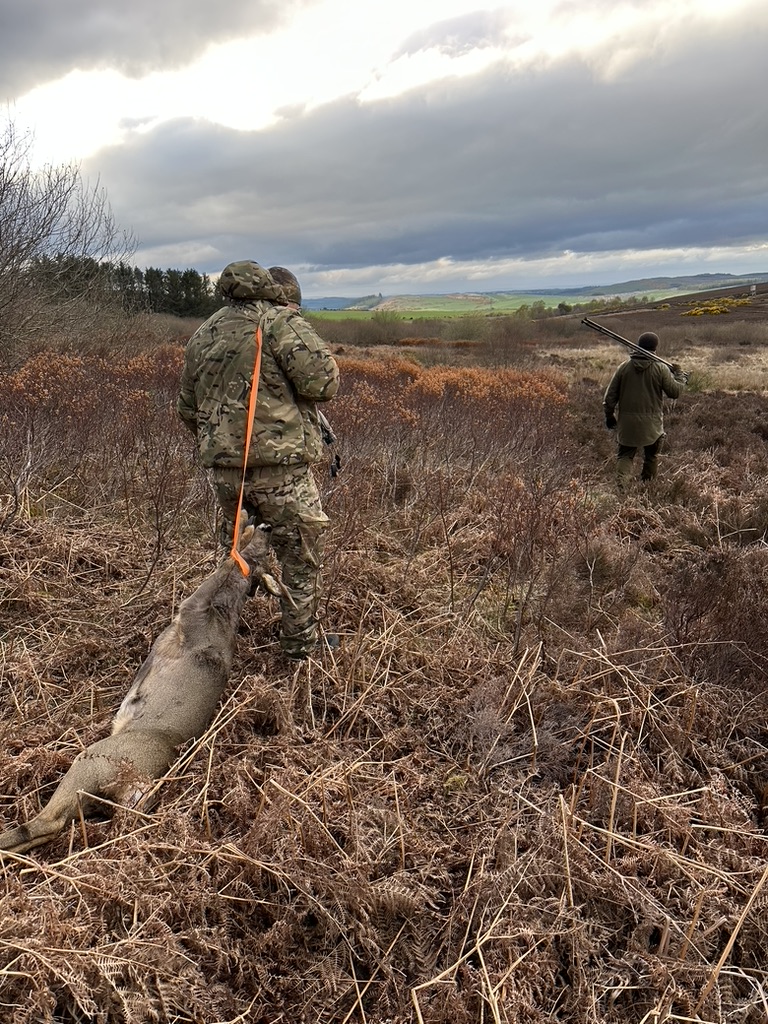 2 hunters with their kill